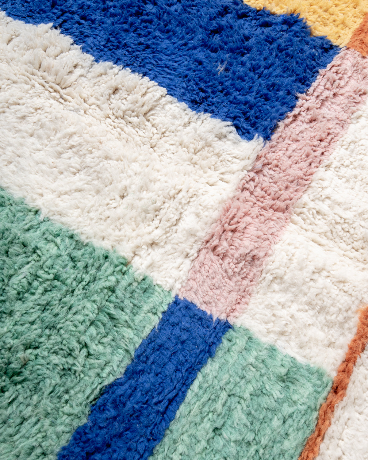 Modern, designer, handcrafted Berber rug from Morocco. Beniourain carpet with beautiful colours and patterns and fluffy wool texture.